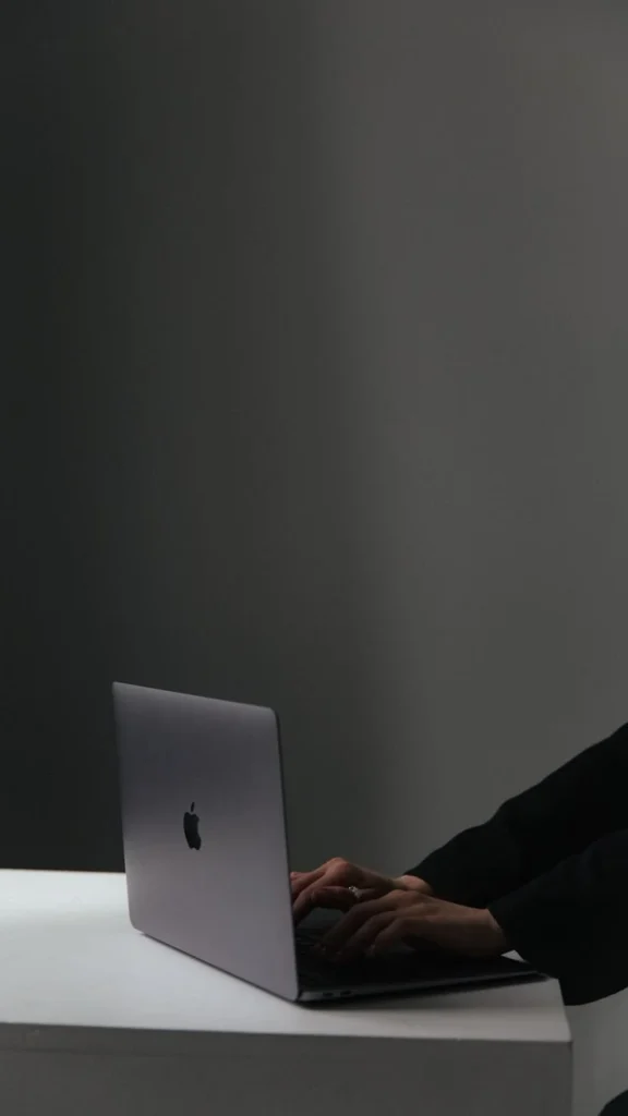 Digital marketer working on a laptop for online marketing and SEO strategy